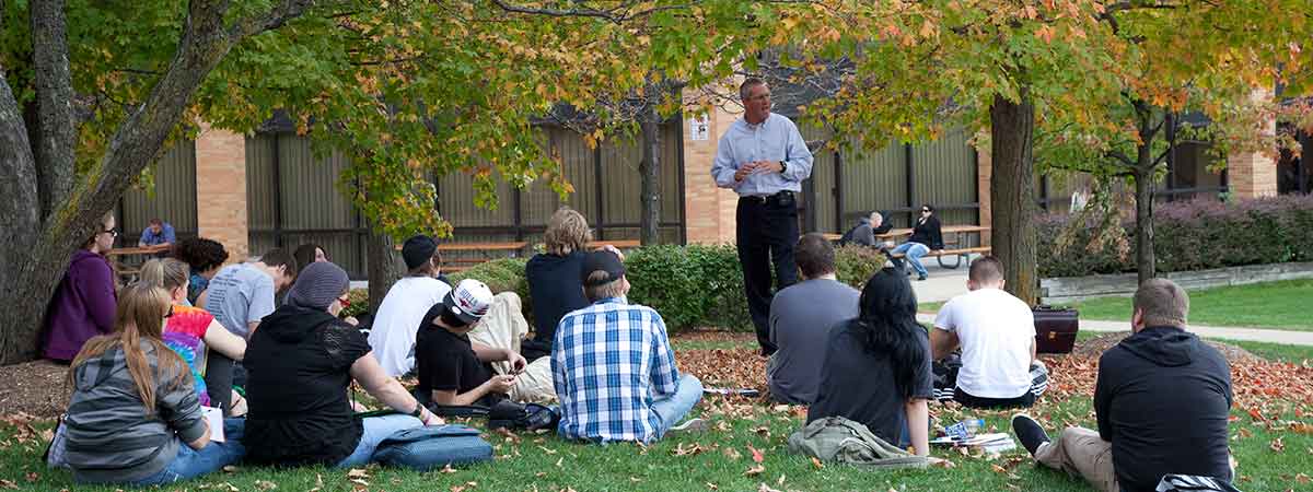 students in class being held outside